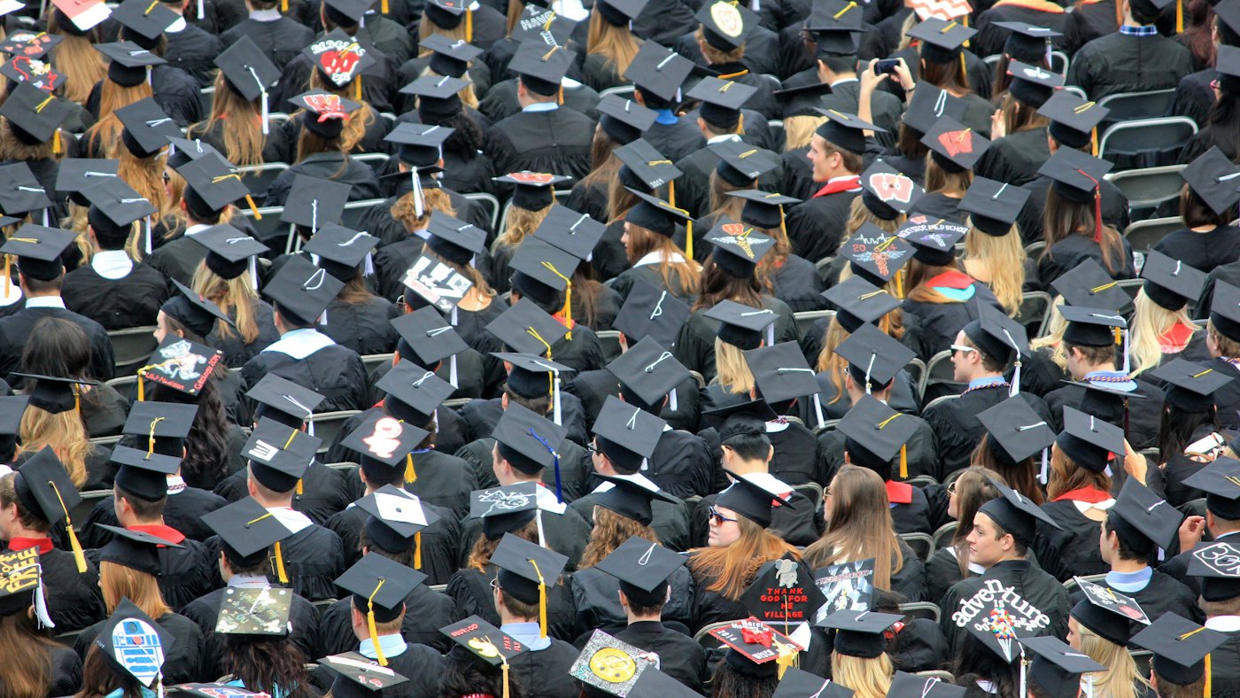Graduates in mortarboards seen from above at an American commencement